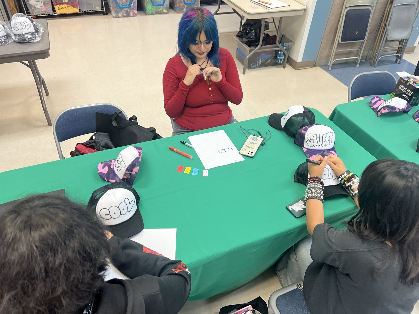 Students working together at a craft table