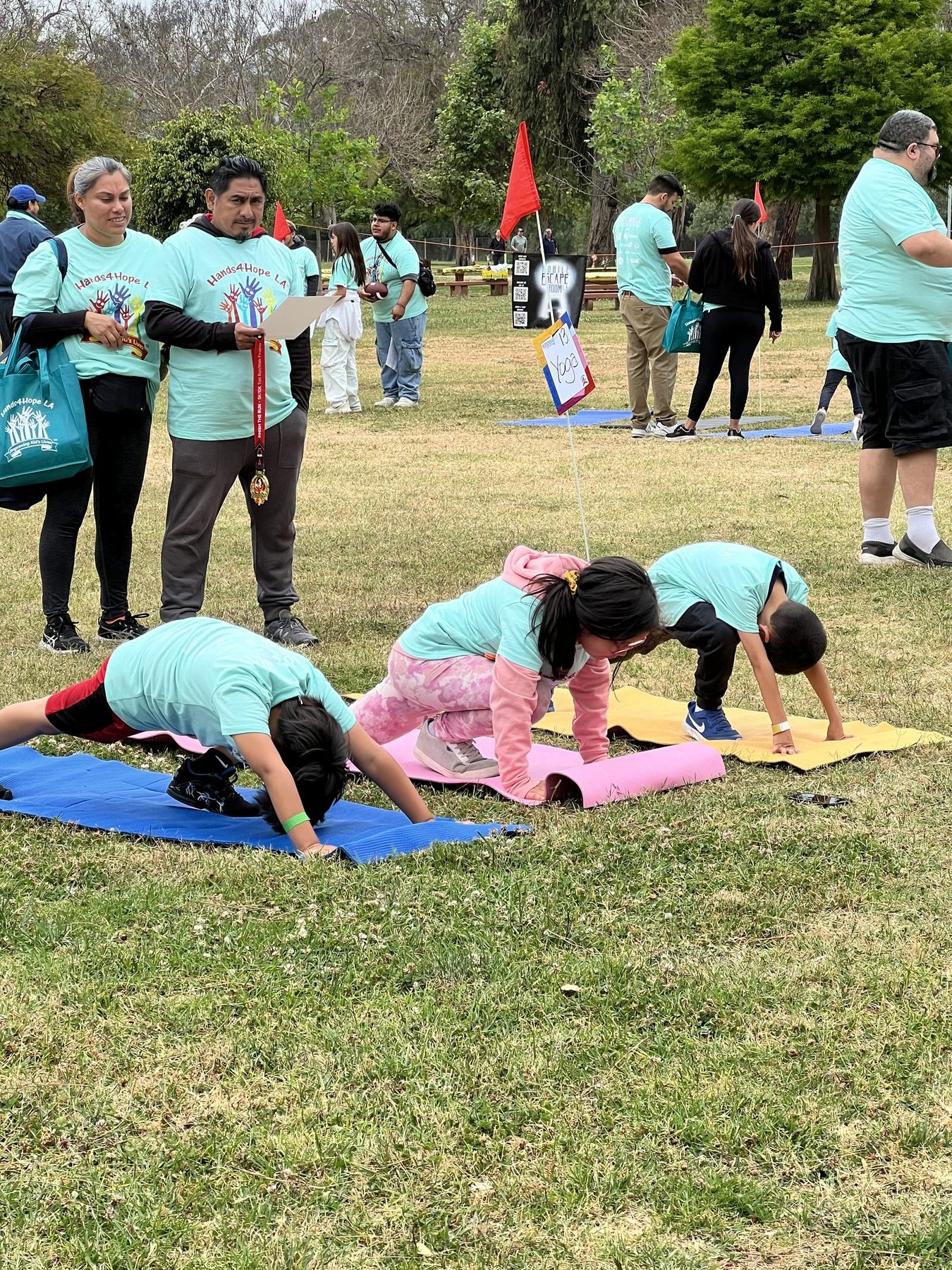 Families stretching together at Hopewalk in North Hollywood Park